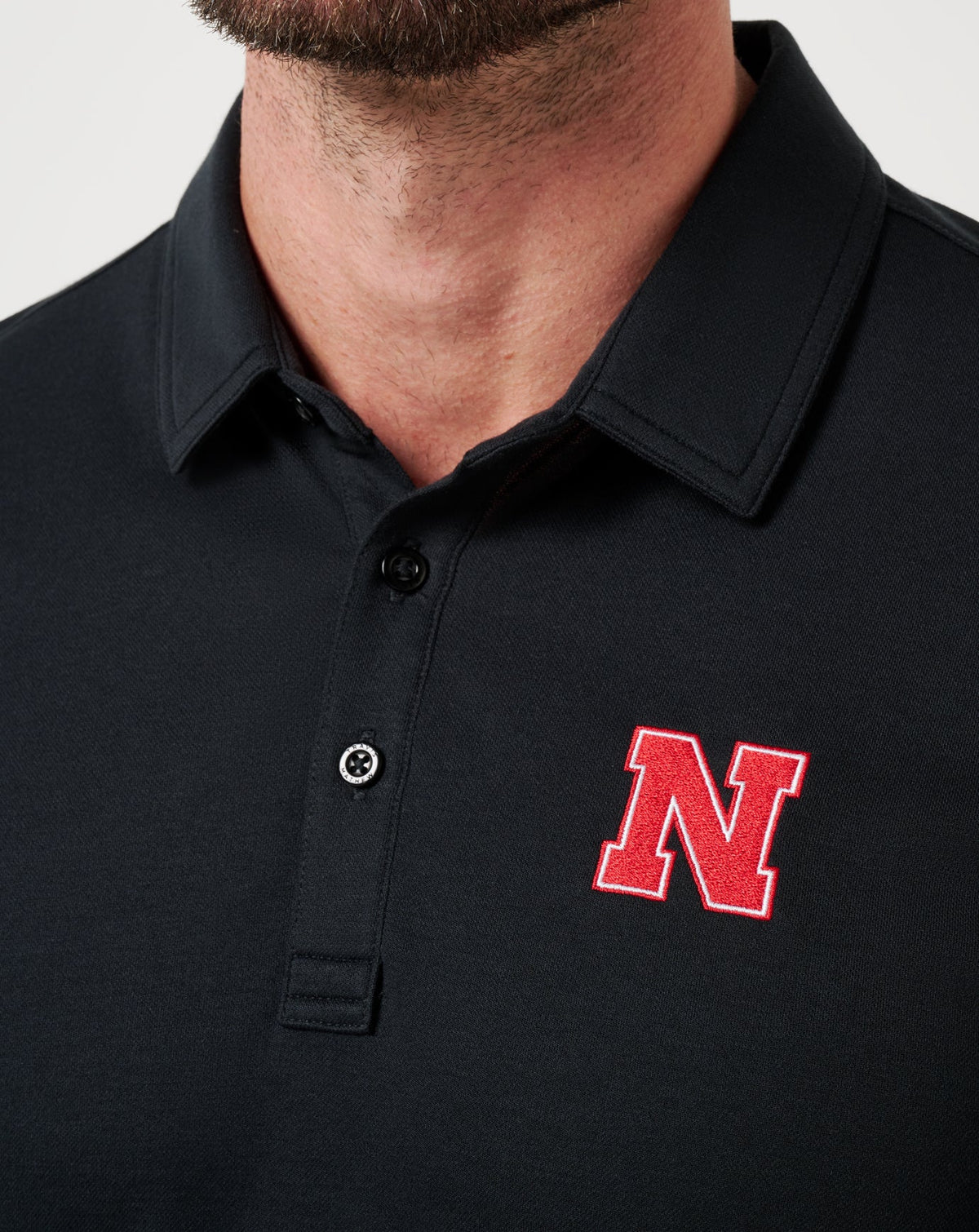 TravisMathew | Nebraska School Pride Polo - Black